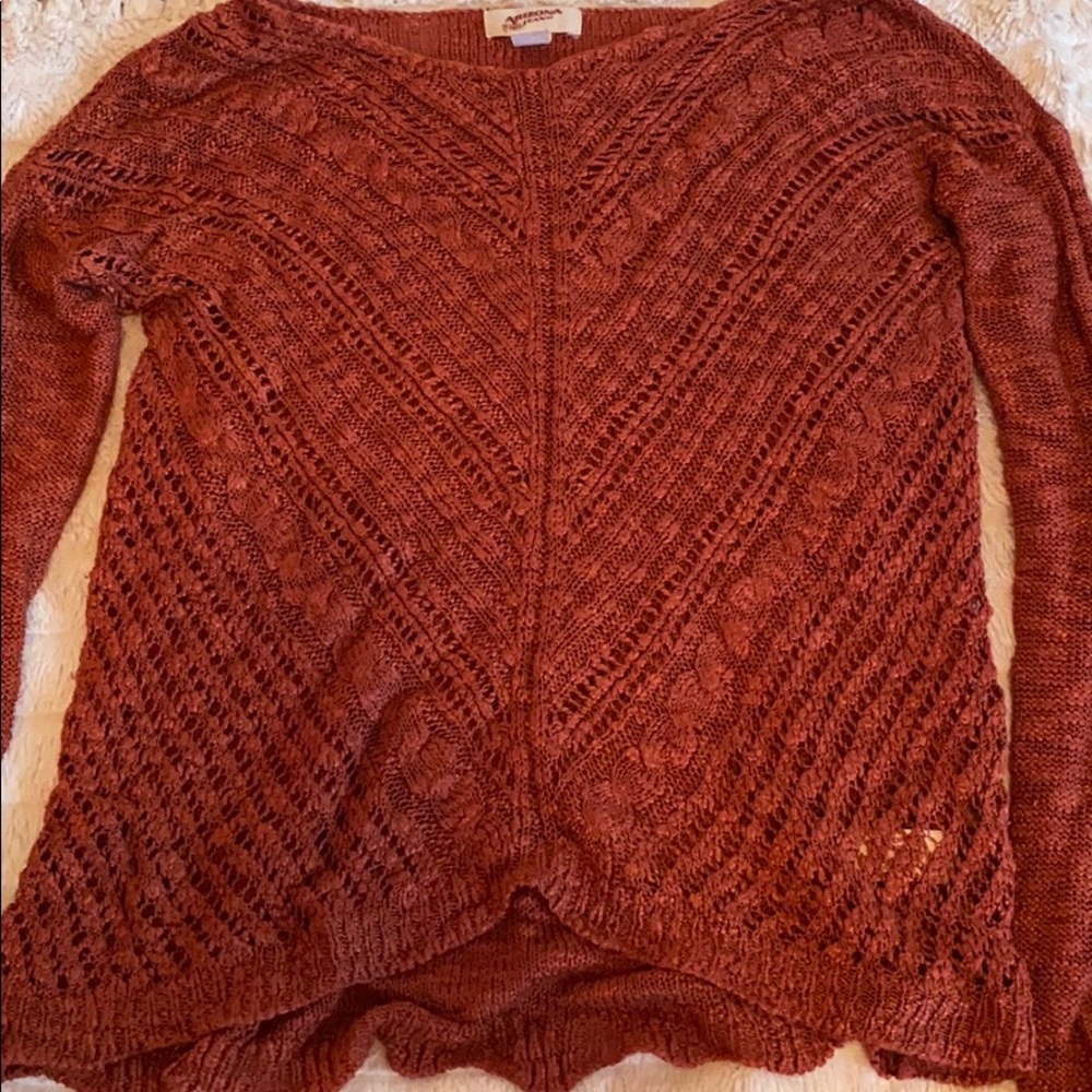 rust-colored sweater